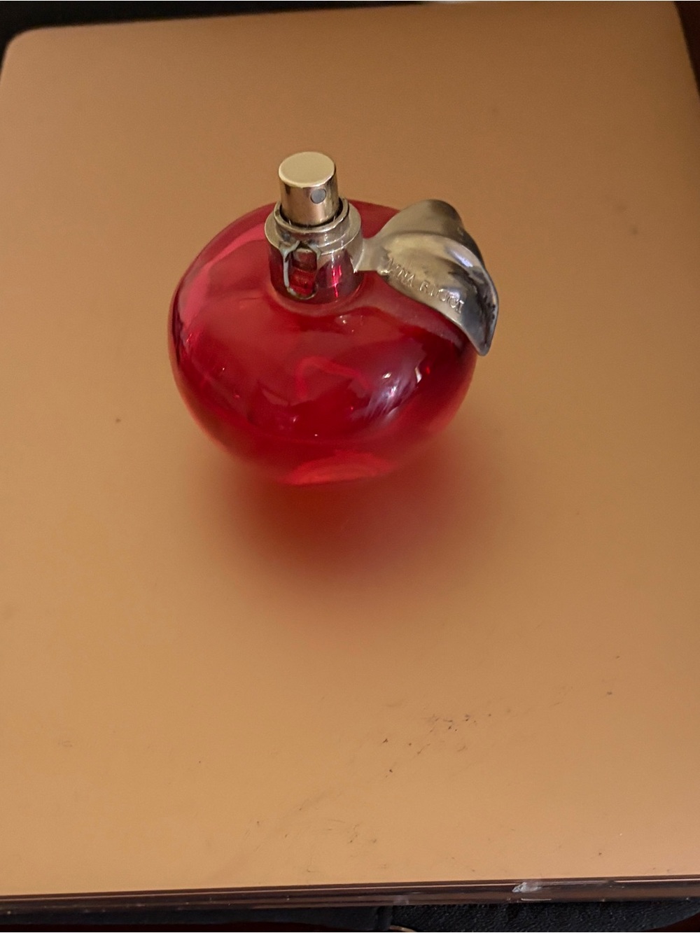 Nina Ricci Red Apple-Shaped Fragrance Bottle with Silver Leaf